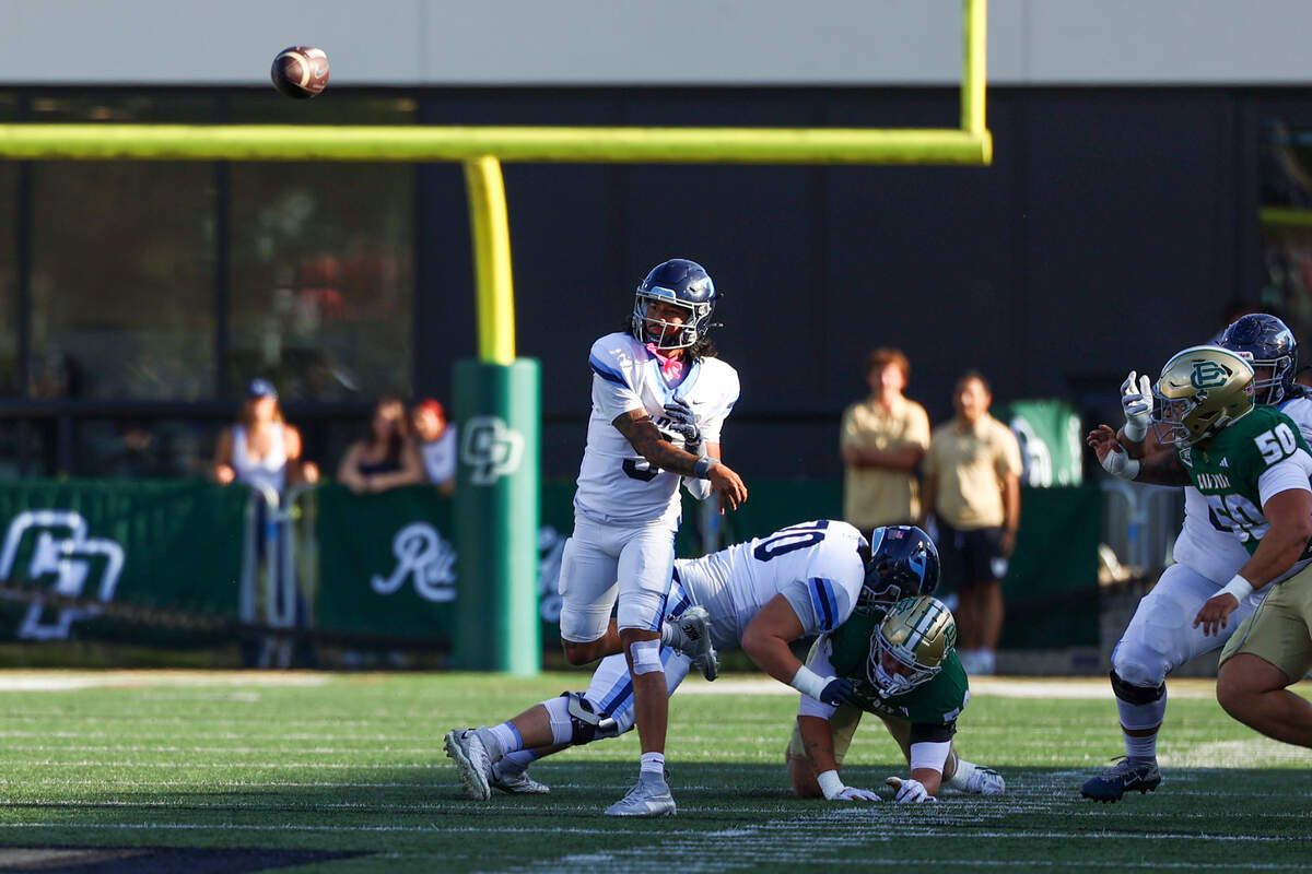 University of San Diego quarterback Dom Nankil throws a quick pass in the first quarter at Mustang Memorial Field on Sept. 19, 2026. The Mustangs lost to the Toreros 38-35 on Homecoming night on a last-minute field goal.